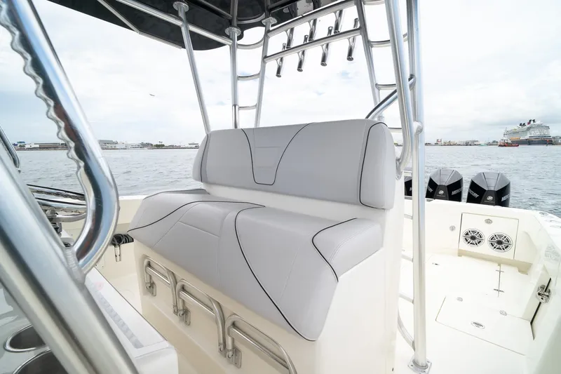 Slide: The Image of 2018 SeaVee 390Z boat interior with cushioned seating and multiple outboard motors. - 35