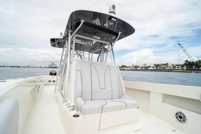Slide: The Image of 2018 SeaVee 390Z boat with sleek seating and open deck on calm waters. - 39