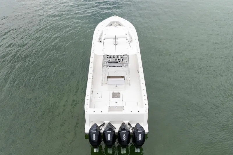 Slide: The Image of 2018 SeaVee 390Z boat with four engines on calm water. - 4