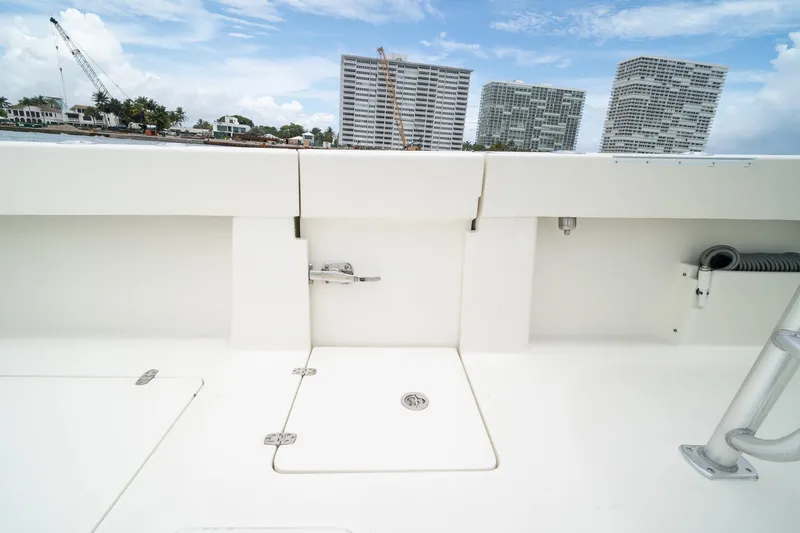 Slide: The Image of 2018 SeaVee 390Z boat deck with urban skyline in background. - 40