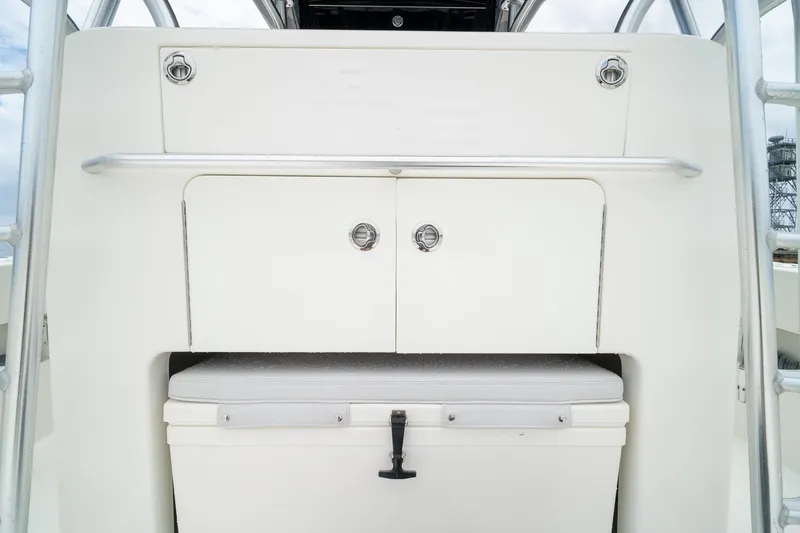 Slide: The Image of 2018 SeaVee 390Z boat storage compartment with cooler and stainless steel rail. - 41
