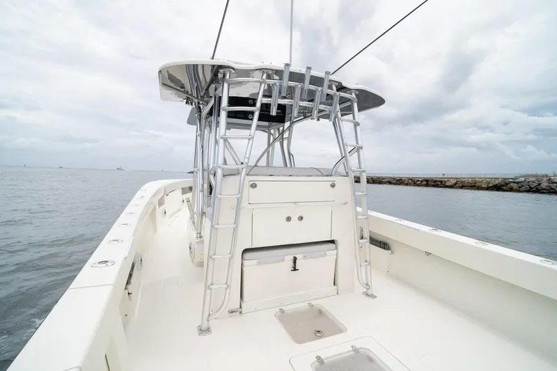 Slide: The Image of 2018 SeaVee 390Z boat on water, featuring sleek design and spacious deck. - 43