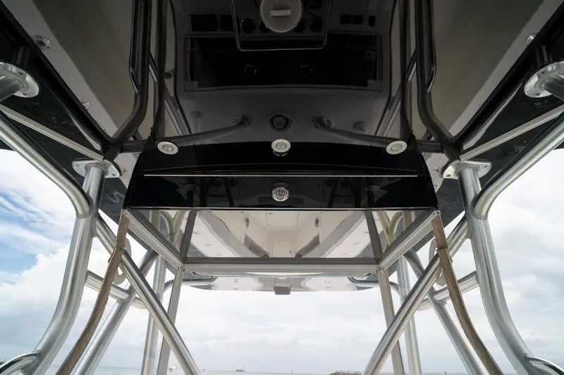 Slide: The Image of 2018 SeaVee 390Z boat's T-top structure with stainless steel supports and overhead electronics. - 46