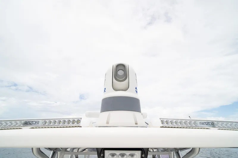 Slide: The Image of 2018 SeaVee 390Z boat radar and lighting system against cloudy sky. - 48