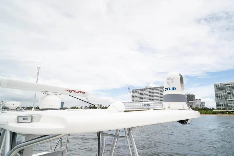 Slide: The Image of 2018 SeaVee 390Z boat with Raymarine and FLIR equipment, cityscape in background. - 49