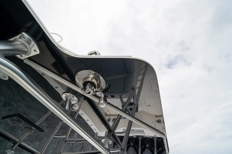 Slide: The Image of 2018 SeaVee 390Z boat underside view with stainless steel fittings against cloudy sky. - 51