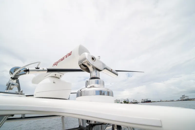 Slide: The Image of Radar equipment on a 2018 SeaVee 390Z boat under a cloudy sky. - 52