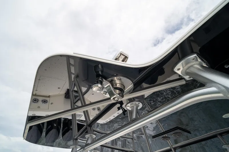 Slide: The Image of 2018 SeaVee 390Z boat's sleek T-top structure against a cloudy sky. - 53