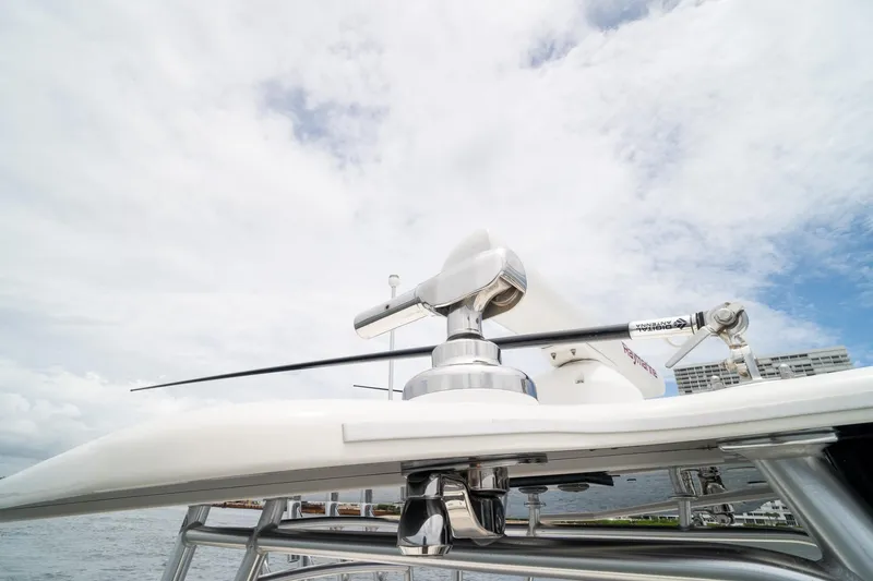 Slide: The Image of Radar equipment on a 2018 SeaVee 390Z boat under a cloudy sky. - 54