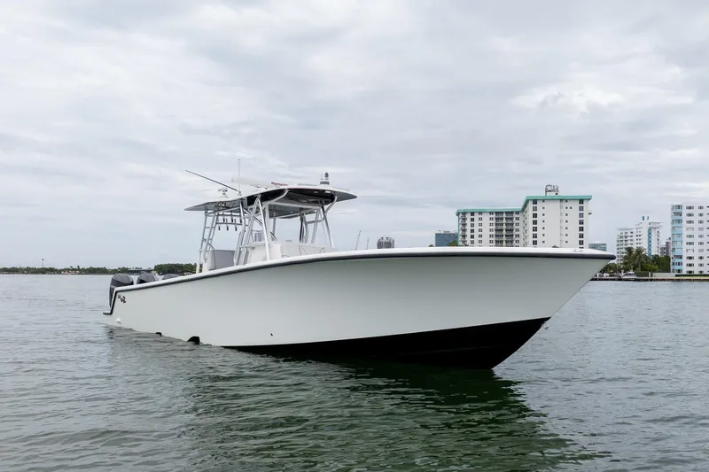 Slide: The Image of 2018 SeaVee 390Z boat on water with cityscape background. - 6
