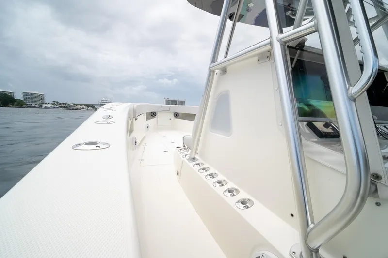 Slide: The Image of 2018 SeaVee 390Z boat deck with stainless steel railings on a cloudy day. - 62