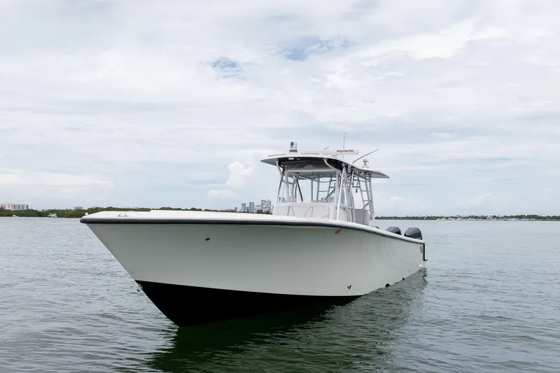 Slide: The Image of 2018 SeaVee 390Z boat on calm water under cloudy sky. - 8