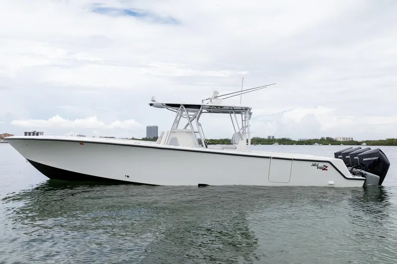 Slide: The Image of 2018 SeaVee 390Z boat with triple Mercury engines on calm water. - 9