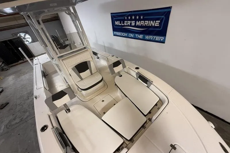 Slide: The Image of 2026 Robalo 226 Cayman boat interior at Miller's Marine showroom. - 16