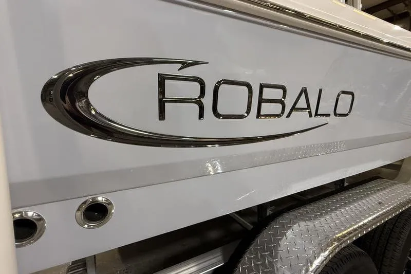 Slide: The Image of 2026 Robalo 226 Cayman boat logo on sleek white hull. - 4