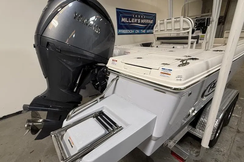 Slide: The Image of 2026 Robalo 226 Cayman boat with Yamaha engine, showcased at Miller's Marine. - 5