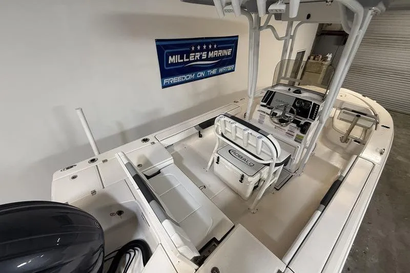 Slide: The Image of 2026 Robalo 226 Cayman boat interior at Miller's Marine showroom. - 8