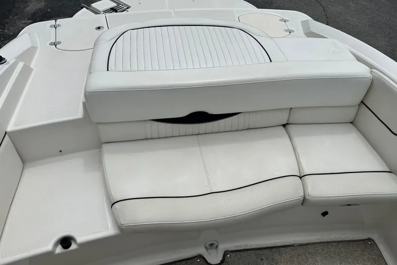 Slide: The Image of White seating area on a 2008 Monterey 194FS boat, featuring sleek design and comfortable upholstery. - 8