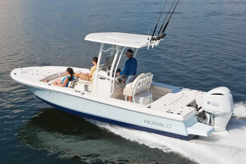 Slide: The Image of Manufacturer Provided Image: 2017 Robalo 246 Cayman boat cruising on water with passengers. - 13