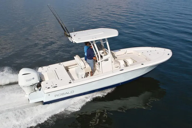 Slide: The Image of Manufacturer Provided Image: 2017 Robalo 246 Cayman boat cruising on water. - 16