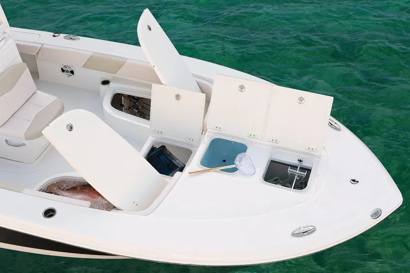 Slide: The Image of Manufacturer Provided Image: 2017 Robalo 246 Cayman boat with open storage compartments on deck. - 17