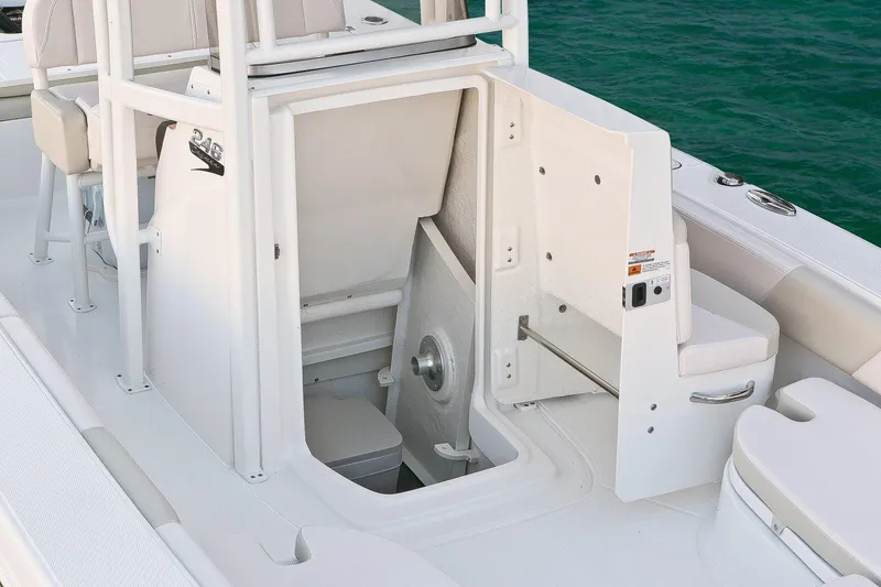 Slide: The Image of Manufacturer Provided Image: 2017 Robalo 246 Cayman boat interior with open storage compartment. - 18