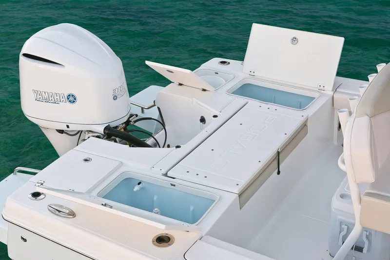 Slide: The Image of Manufacturer Provided Image: 2017 Robalo 246 Cayman boat with Yamaha outboard engine and storage compartments. - 21