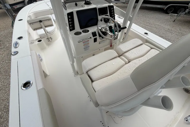 Slide: The Image of 2017 Robalo 246 Cayman boat interior with steering console and seating. - 3