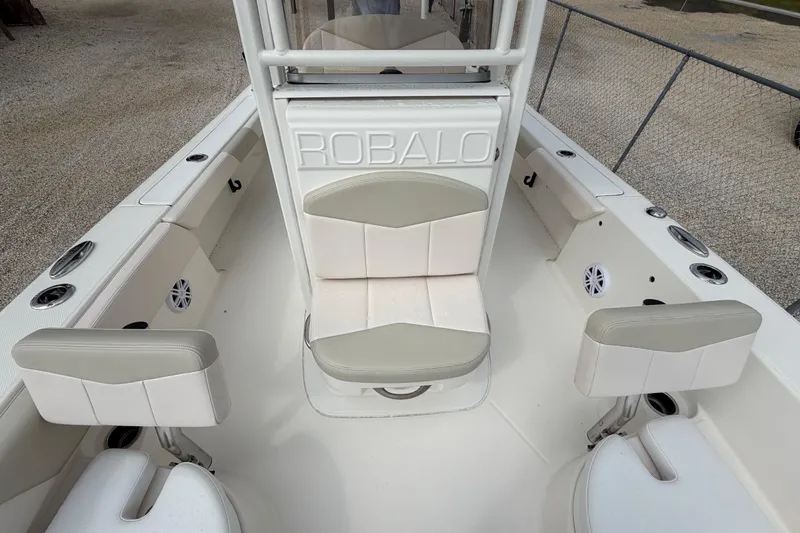 Slide: The Image of 2017 Robalo 246 Cayman boat interior with seating and console. - 7