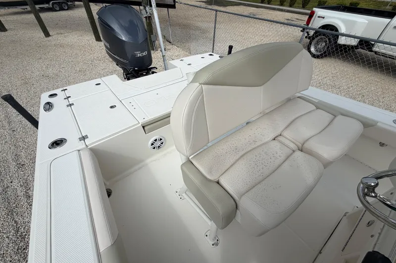Slide: The Image of 2017 Robalo 246 Cayman boat interior with seating and Yamaha 300 engine. - 9