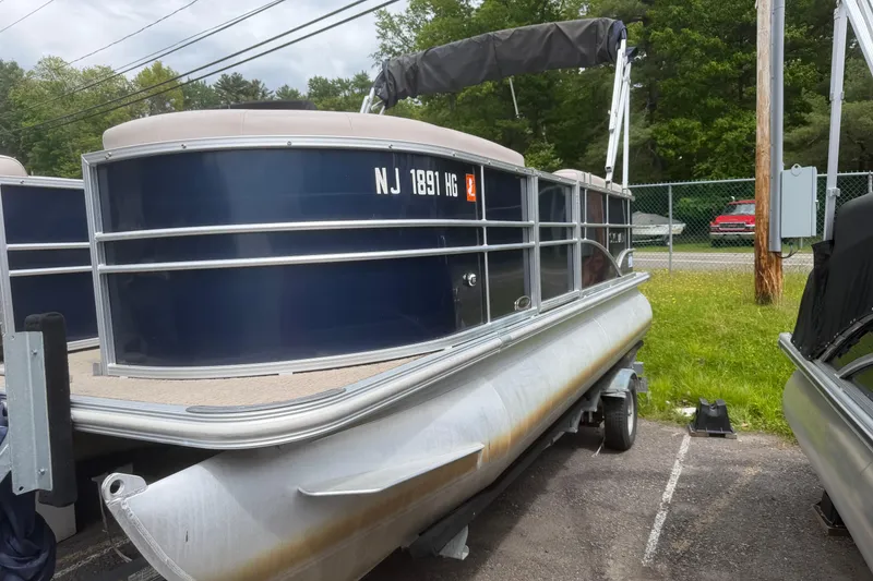 The Image of 2014 Sylvan Mirage Cruise 818 CR pontoon boat on trailer, parked outdoors. - 3
