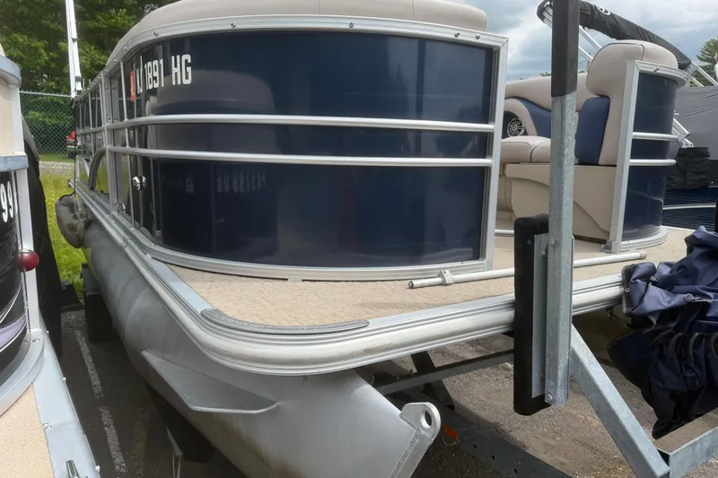 Slide: The Image of 2014 Sylvan Mirage Cruise 818 CR pontoon boat, docked with blue and beige seating. - 4