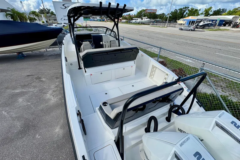 Slide: The Image of 2026 Navan S30 boat with dual Mercury engines, docked in a marina setting. - 10