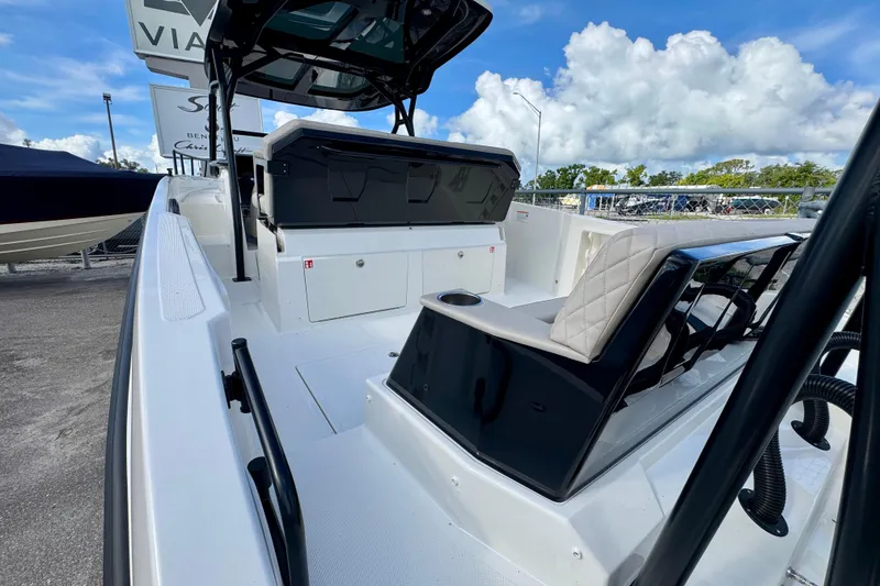 Slide: The Image of 2026 Navan S30 boat interior with modern seating and sleek design under a blue sky. - 11