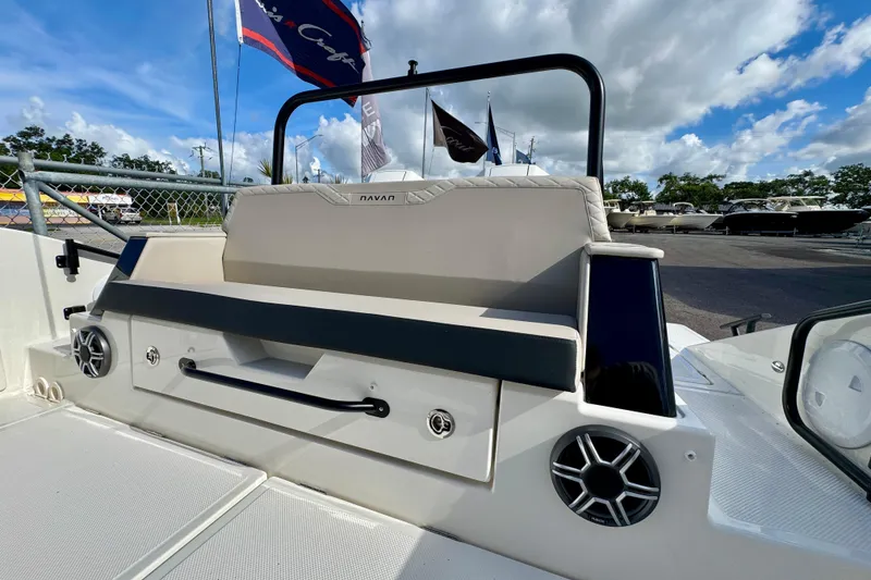 Slide: The Image of 2026 Navan S30 boat interior with seating, speakers, and clear sky background. - 12