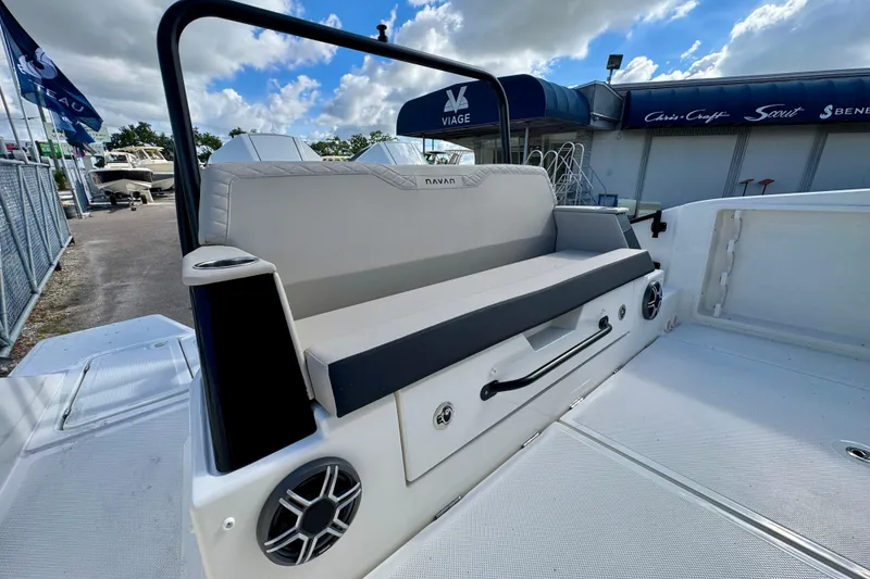 Slide: The Image of 2026 Navan S30 boat interior with cushioned seating and speaker system. - 13