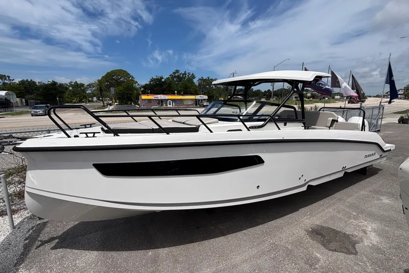 Slide: The Image of 2026 Navan S30 boat displayed outdoors under a clear blue sky. - 2