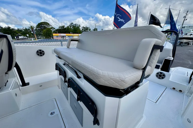 Slide: The Image of Navan S30 2026 boat interior with cushioned seating and storage compartments. - 23