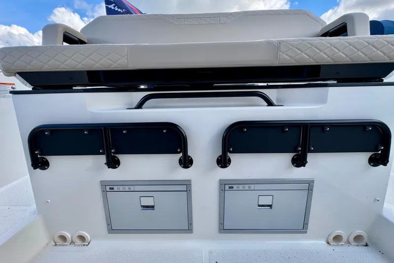Slide: The Image of Navan S30 2026 boat interior with cushioned seating and storage compartments. - 24