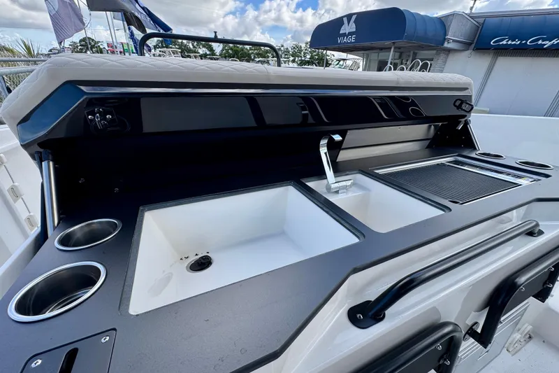 Slide: The Image of Outdoor kitchen setup on a 2026 Navan S30 boat, featuring sink and grill. - 30