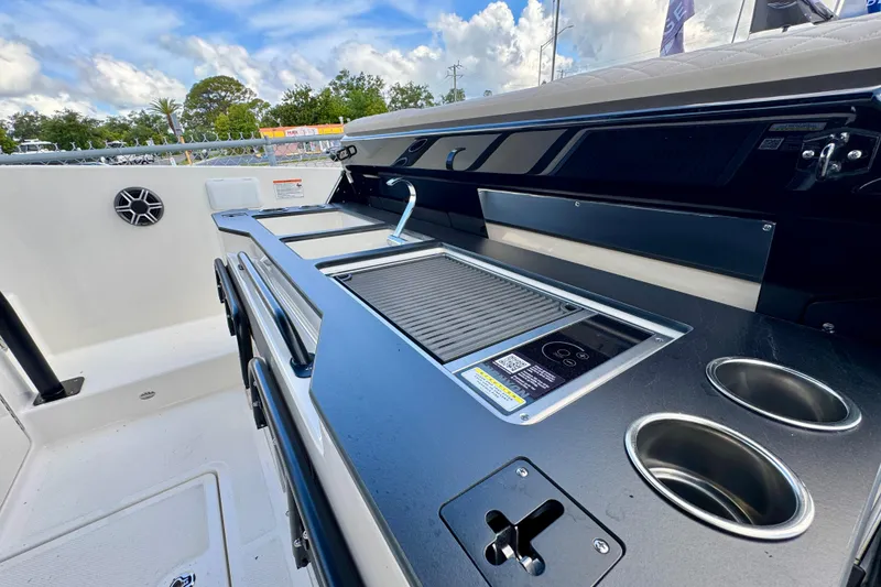 Slide: The Image of Modern Navan S30 boat kitchen with grill, sink, and cup holders, 2026 model. - 31