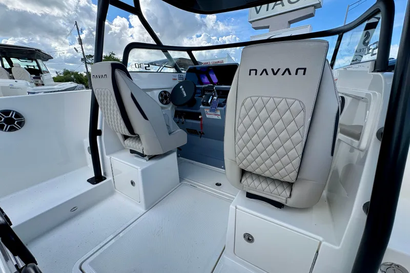 Slide: The Image of Interior of 2026 Navan S30 boat with modern seating and steering console. - 35