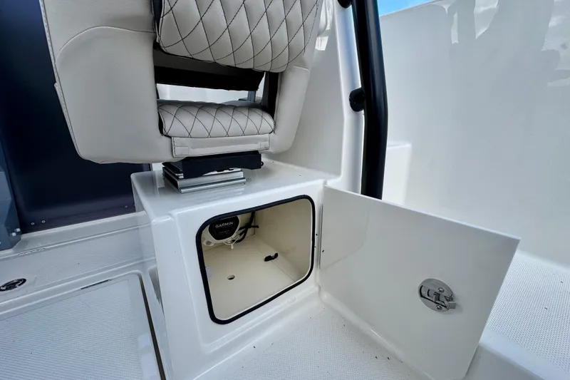 Slide: The Image of 2026 Navan S30 boat interior with open storage compartment and cushioned seat. - 39