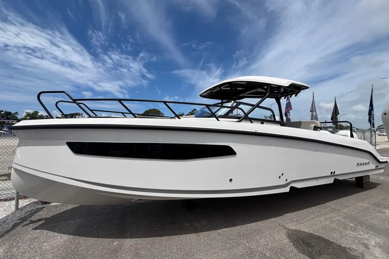 Slide: The Image of 2026 Navan S30 boat displayed outdoors under a clear blue sky. - 4