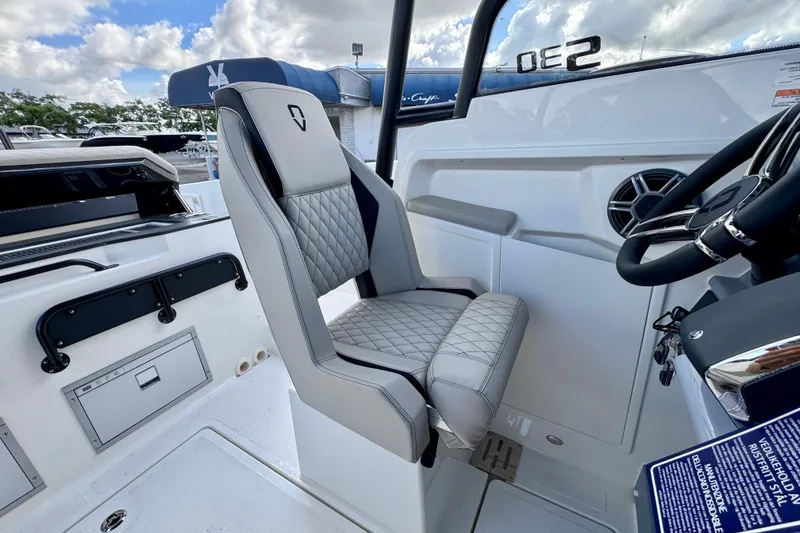 Slide: The Image of Interior of 2026 Navan S30 boat with modern helm and quilted seat design. - 41