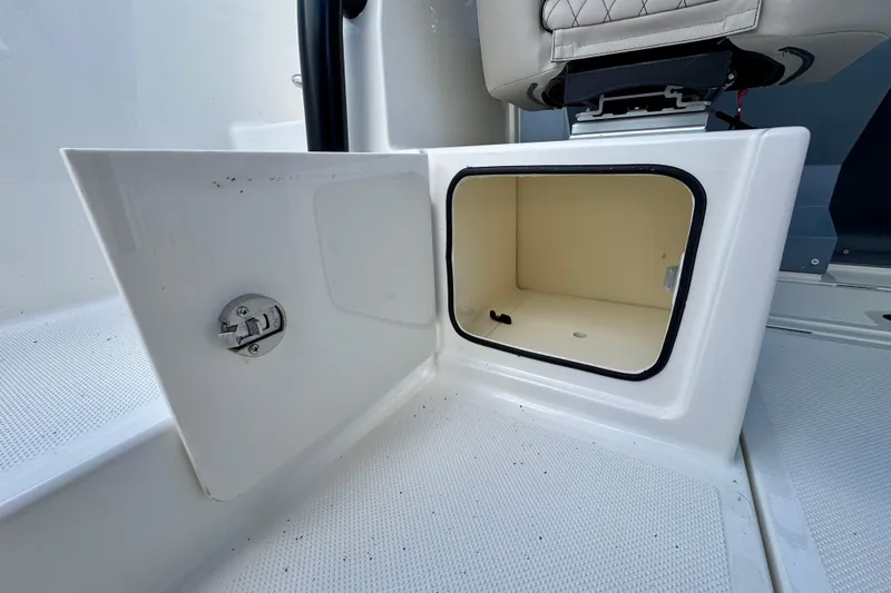 Slide: The Image of Open storage compartment on 2026 Navan S30 boat, featuring a secure latch and clean interior. - 42