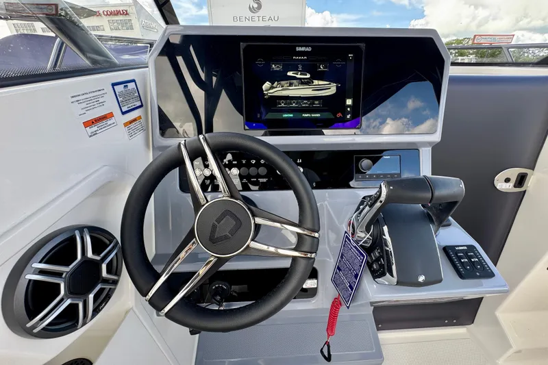 Slide: The Image of 2026 Navan S30 boat dashboard with steering wheel, touchscreen display, and control panel. - 43
