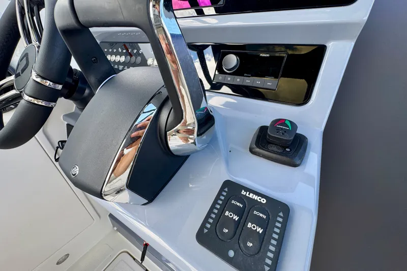 Slide: The Image of Control panel of 2026 Navan S30 boat with steering wheel and navigation controls. - 44