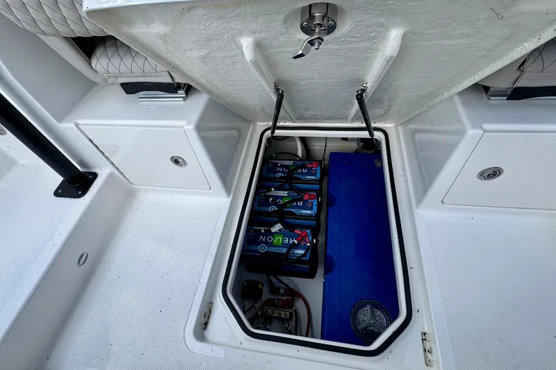 Slide: The Image of Battery compartment of 2026 Navan S30 boat, featuring multiple batteries and storage space. - 46