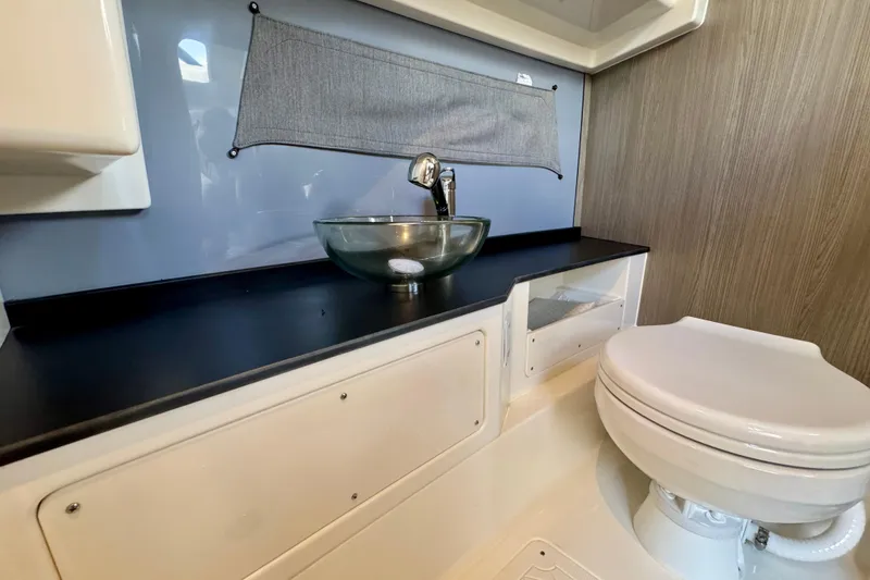 Slide: The Image of Modern bathroom in 2026 Navan S30 with glass sink and compact toilet. - 54